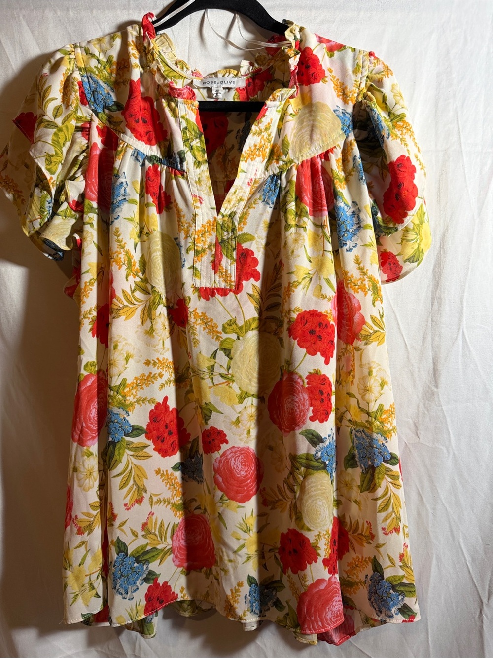 Rose & Olive Cream Floral Ruffle-Trim Tunic with Red, Blue & Yellow Blooms